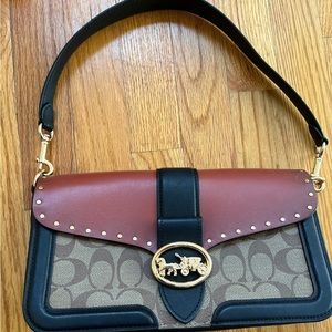 Colorblock. Retails for 290.
Great condition, a small scuff on bottom.